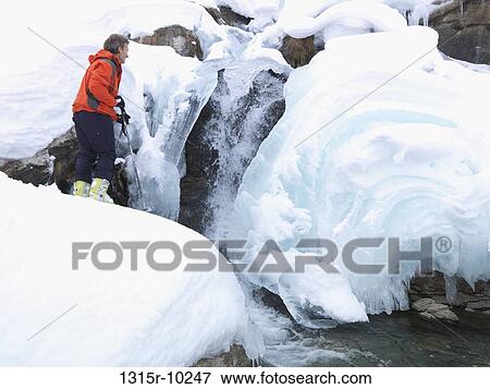 Italy, Piedmont, Po river, Skier admiring waterfall View Large Photo Image Stock Photo - Italy, Piedmont, Po river, Skier admiring waterfall. Fotosearch
