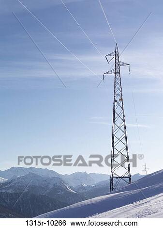 Italy, Piedmont, Power pylons rise above snow covered slopes and mountains View Large Photo Image Stock Photograph - Italy, Piedmont, Power pylons rise above snow covered slopes and mountains. Fotosearch