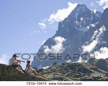 Italy, Piedmont, Teenage kids playing along mountain ridge View Large Photo Image Stock Photography - Italy, Piedmont, Teenage kids playing along mountain ridge. Fotosearch