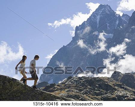 Italy, Piedmont, Teenage kids walking along mountain ridge View Large Photo Image Stock Photograph - Italy, Piedmont, Teenage kids walking along mountain ridge. Fotosearch