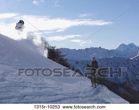 Italy, Piedmont, Teenage skier showing off in front of waiting mother View Large Photo Image Stock Image - Italy, Piedmont, Teenage skier showing off in front of waiting mother. Fotosearch