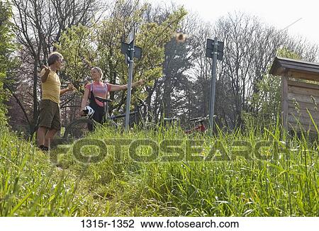 Italy, Piedmont, tourists standing by signpost View Large Photo Image Stock Image - Italy, Piedmont, tourists standing by signpost. Fotosearch