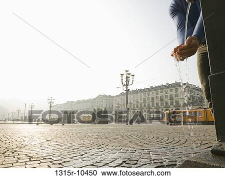 Italy, Piedmont, Turin, man scooping water from fountain View Large Photo Image Stock Image - Italy, Piedmont, Turin, man scooping water from fountain. Fotosearch