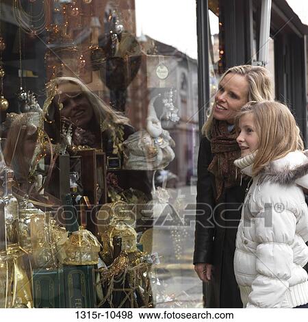 Italy, Piedmont, Turin, Mother and daughter window-shopping View Large Photo Image Stock Photo - Italy, Piedmont, Turin, Mother and daughter window-shopping. Fotosearch