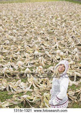 Italy, Piedmont, woman standing in frozen cabbage patch View Large Photo Image Stock Image - Italy, Piedmont, woman standing in frozen cabbage patch. Fotosearch