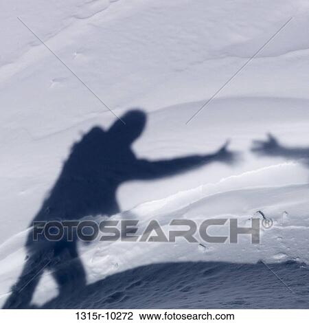 Stock Image - Italy, Shadow detail of hand offering assistance to woman hiker. Fotosearch