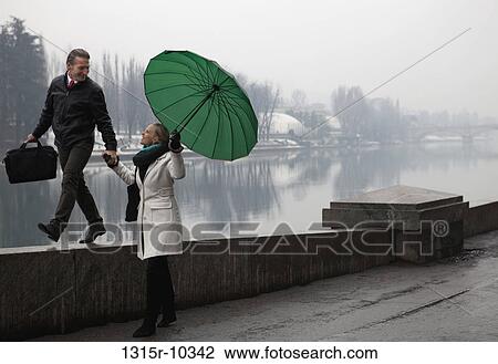 Italy, Turin, Couple walking along promenade wall View Large Photo Image Stock Image - Italy, Turin, Couple walking along promenade wall. Fotosearch