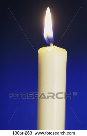 Stock Image - Lit candle. Fotosearch