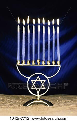 Lit candles on a menorah View Large Photo Image Stock Image - Lit candles on a menorah. Fotosearch