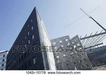 Low angle view of a building at a construction site View Large Photo Image Stock Photo - Low angle view of a building at a construction site. Fotosearch