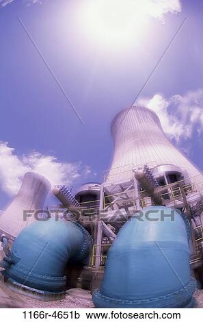 Stock Image - Low angle view of a power plant. Fotosearch
