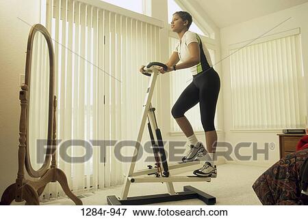 Low angle view of a woman exercising View Large Photo Image Stock Photo - Low angle view of a woman exercising. Fotosearch
