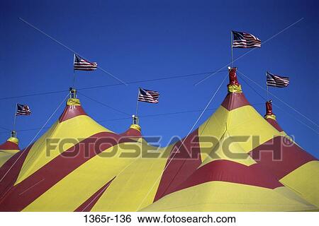 Low angle view of flag of the United States of American on top of a circus tent View Large Photo Image Stock Photograph - Low angle view of flag of the United States of American on top of a circus tent. Fotosearch