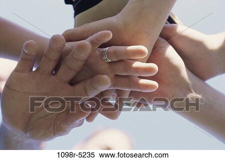 Low angle view of hands together View Large Photo Image Stock Photography - Low angle view of hands together. Fotosearch