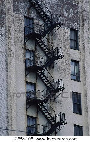 Low angle view of the fire escape of a building View Large Photo Image Stock Photography - Low angle view of the fire escape of a building. Fotosearch