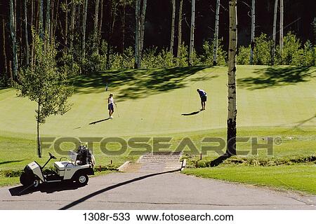 Man and woman playing golf, Vail, Colorado, USA View Large Photo Image Stock Image - Man and woman playing golf, Vail, Colorado, USA. Fotosearch