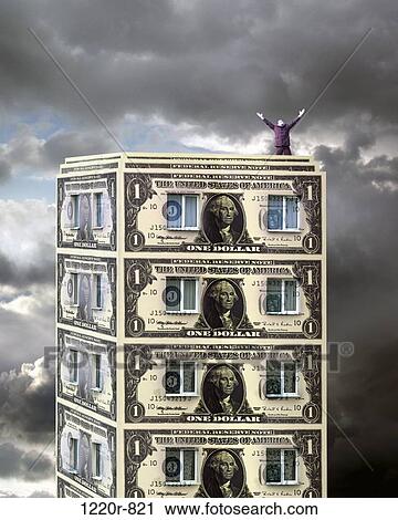 Man standing on top of a building made from paper money View Large Photo Image Stock Image - Man standing on top of a building made from paper money. Fotosearch