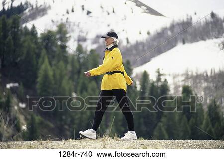 Stock Image - Mature woman walking. Fotosearch