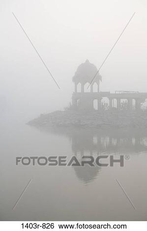 Morning fog at Lake Gadisar in Jaisalmer, India in Rajasthan state View Large Photo Image Stock Photograph - Morning fog at Lake Gadisar in Jaisalmer, India in Rajasthan state. Fotosearch