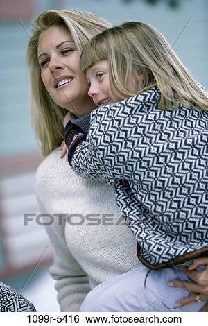 Mother holding her daughter. View Large Photo Image Stock Photograph - Mother holding her daughter.. Fotosearch
