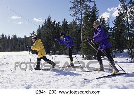 Mother skiing with her son and daughter View Large Photo Image Stock Image - Mother skiing with her son and daughter. Fotosearch