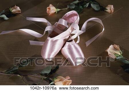 Stock Image - Pair of ballet slippers and roses. Fotosearch