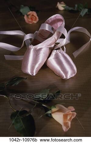 Stock Image - Pair of ballet slippers and roses. Fotosearch