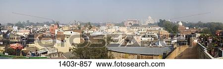 Panoramic view of the chaos of guest houses, hotels and roof top restaurants that comprises the backpacker's enclave of Taj Ganj below the South Gate of the Taj Mahal in Agra, India View Large Photo Image Stock Photo - Panoramic view of the chaos of guest houses, hotels and roof top restaurants that comprises the backpacker's enclave of Taj Ganj below the South Gate of the Taj Mahal in Agra, India. Fotosearch