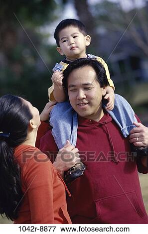 Stock Photo - Parents with their son. Fotosearch