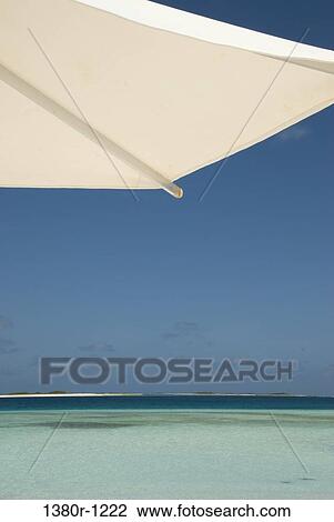 Patio umbrella on the beach, Los Roques National Park, Los Roques, Venezuela View Large Photo Image Stock Image - Patio umbrella on the beach, Los Roques National Park, Los Roques, Venezuela. Fotosearch
