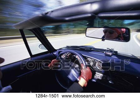 Person driving a convertible car View Large Photo Image Stock Image - Person driving a convertible car. Fotosearch