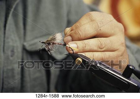 Person making a fishing lure View Large Photo Image Stock Photo - Person making a fishing lure. Fotosearch