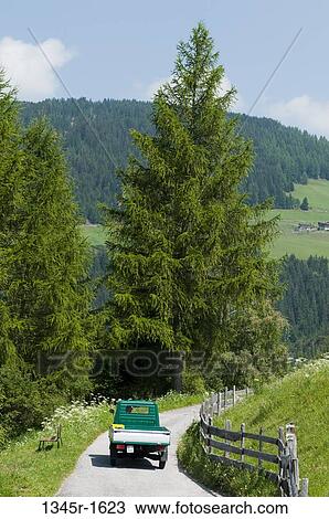 Pick-up truck moving on the road, Santa Maddalena, Funes Valley, Dolomites, Trentino-Alto-Adige, Italy View Large Photo Image Stock Image - Pick-up truck moving on the road, Santa Maddalena, Funes Valley, Dolomites, Trentino-Alto-Adige, Italy. Fotosearch