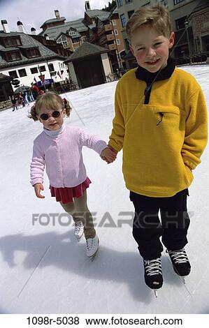 Portrait of a boy and a girl holding hands View Large Photo Image Stock Photo - Portrait of a boy and a girl holding hands. Fotosearch