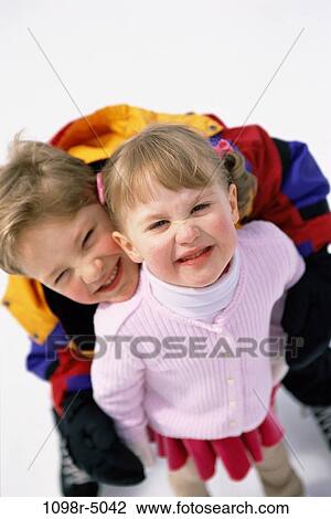 Portrait of a boy and a girl smiling View Large Photo Image Stock Image - Portrait of a boy and a girl smiling. Fotosearch
