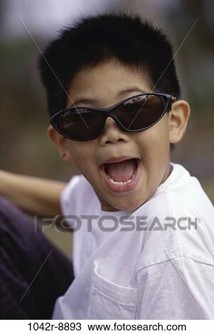 Portrait of a boy laughing View Large Photo Image Stock Image - Portrait of a boy laughing. Fotosearch