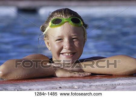 Portrait of a girl leaning against a swimming pool wall View Large Photo Image Stock Photography - Portrait of a girl leaning against a swimming pool wall. Fotosearch