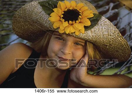 Portrait of a girl lying on a hammock View Large Photo Image Stock Photography - Portrait of a girl lying on a hammock. Fotosearch