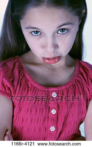 Portrait of a girl making a face View Large Photo Image Stock Image - Portrait of a girl making a face. Fotosearch