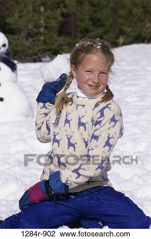 Portrait of a girl playing in the snow View Large Photo Image Stock Image - Portrait of a girl playing in the snow. Fotosearch