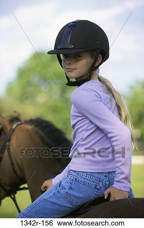Portrait of a girl riding a Welsh pony View Large Photo Image Stock Photograph - Portrait of a girl riding a Welsh pony. Fotosearch
