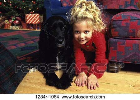 Picture - Portrait of a girl sitting with her dog. Fotosearch