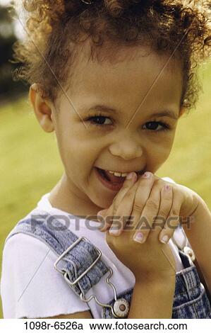 Stock Image - Portrait of a girl smiling. Fotosearch