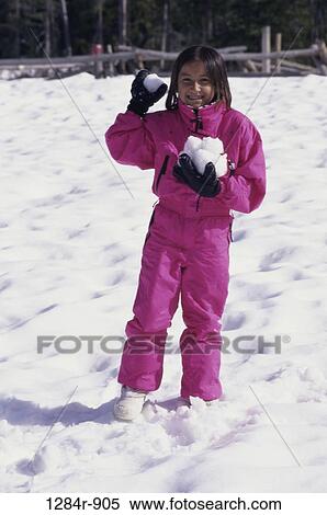 Portrait of a girl throwing snowballs View Large Photo Image Stock Photography - Portrait of a girl throwing snowballs. Fotosearch