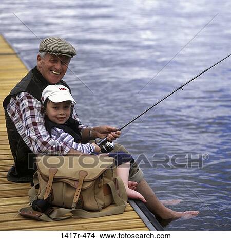 Picture - Portrait of a grandfather fishing with his grandson. Fotosearch