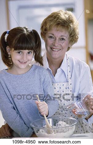 Stock Image - Portrait of a grandmother and her granddaughter smiling. Fotosearch