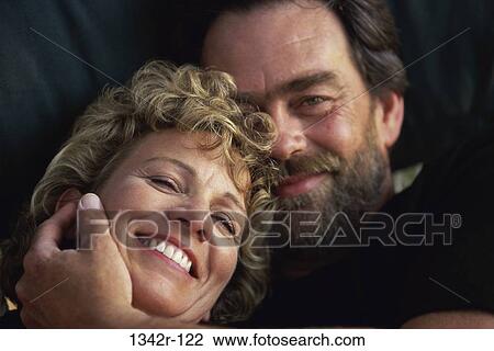 Portrait of a mid adult couple smiling View Large Photo Image Stock Image - Portrait of a mid adult couple smiling. Fotosearch