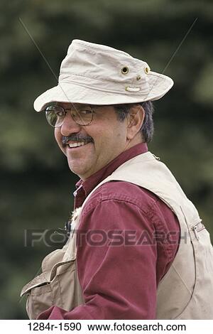 Stock Image - Portrait of a mid adult man smiling. Fotosearch