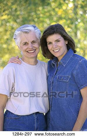 Portrait of a mother and her daughter smiling View Large Photo Image Stock Photo - Portrait of a mother and her daughter smiling. Fotosearch