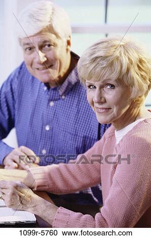 Stock Image - Portrait of a senior couple smiling. Fotosearch